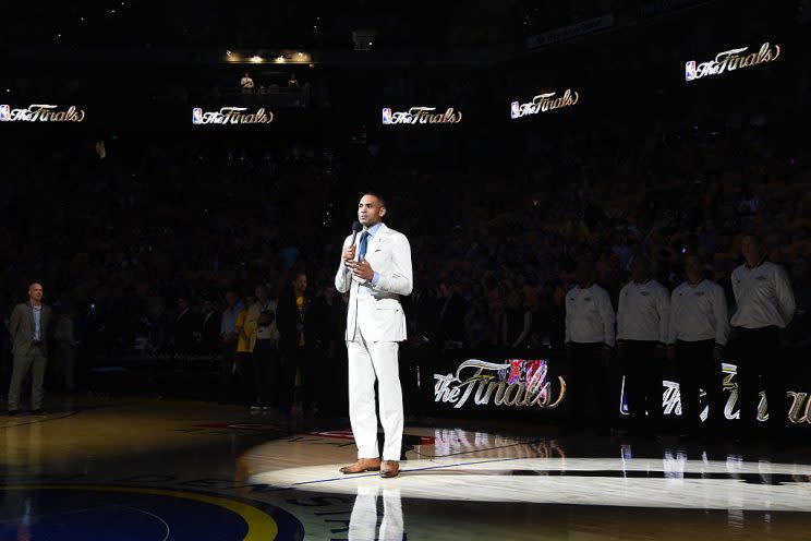 Former Magic star Grant Hill asks for a moment of silence for the victims in the Orlando nightclub shooting before Game Five of the NBA Finals. (Getty Images)