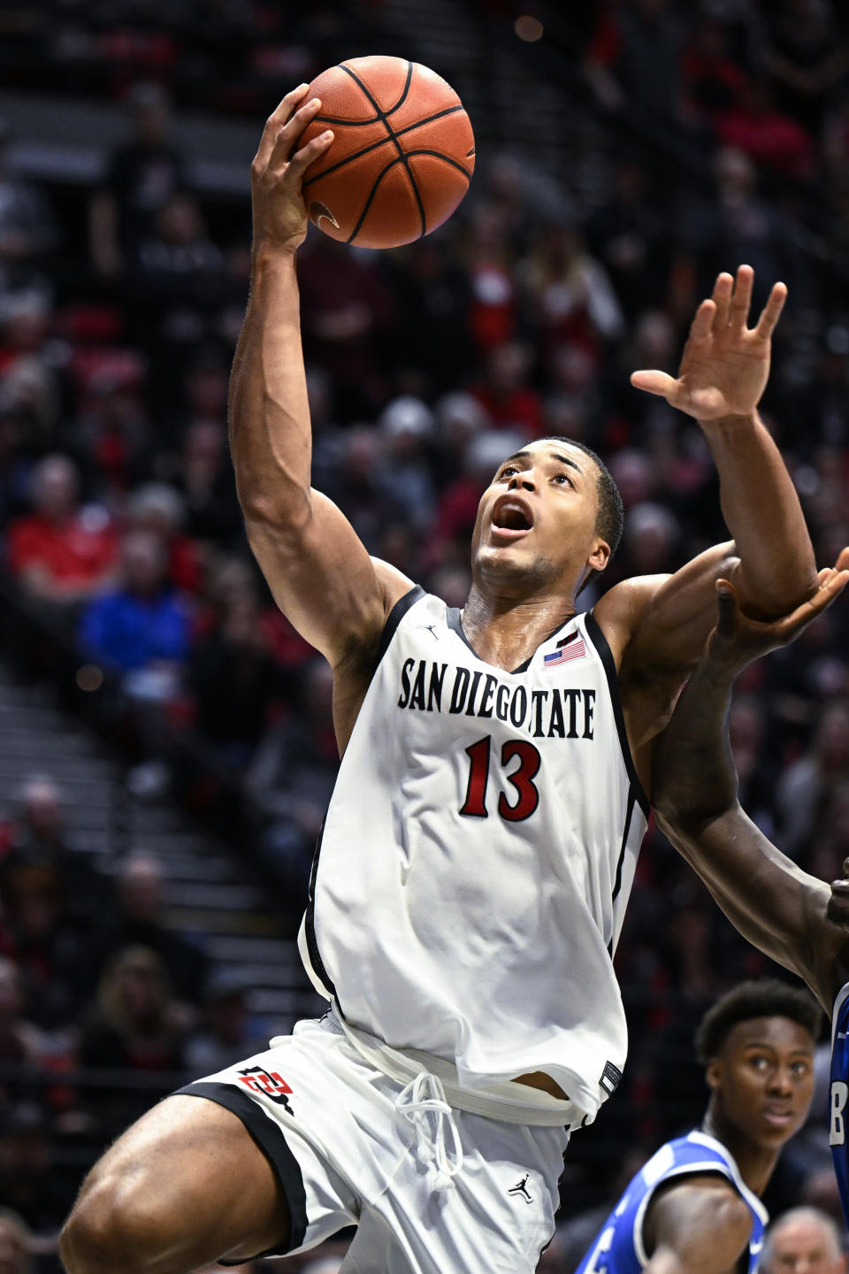 San Diego State forward Jaedon LeDee (13) shoots during the second half of the team's NCAA college basketball game against BYU on Friday, Nov. 11, 2022, in San Diego. (AP Photo/Denis Poroy)