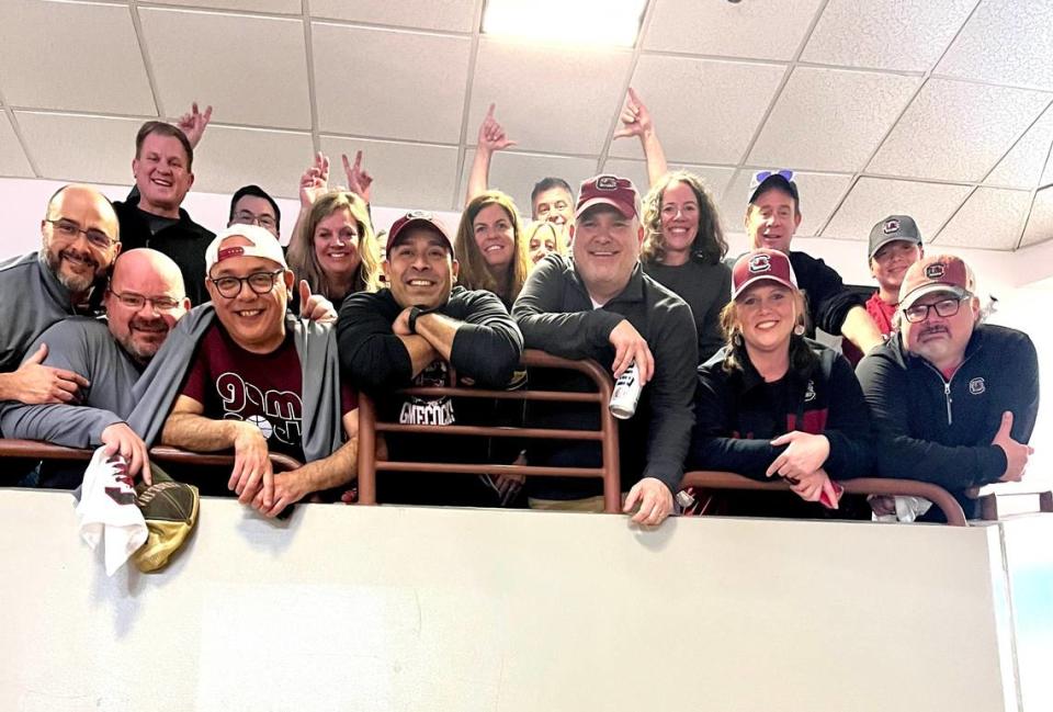 In the suite at Colonial Life Arena, Lamont Paris’ friends from Findlay High School pose for a picture. Jayson Montgomery