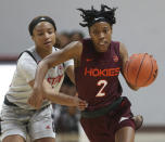 North Carolina State's Kai Crutchfield fouls Virginia Tech's Aisha Sheppard (2) during overtime in an NCAA college basketball game Thursday, Jan. 28, 2021, in Blacksburg, Va. (Matt Gentry/The Roanoke Times via AP, Pool)