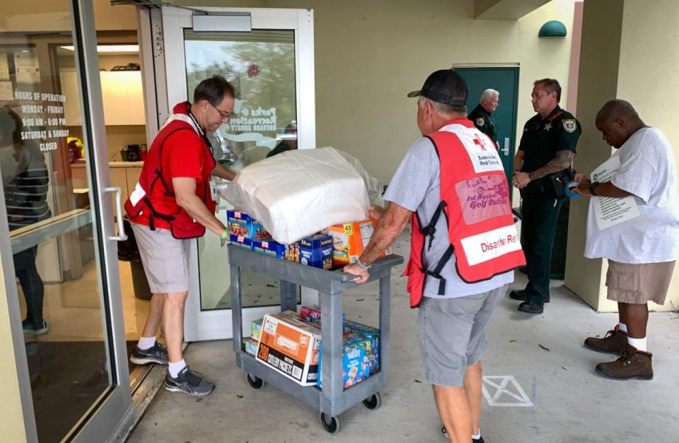 Red Cross volunteers were bring supplies into the South Mainland Community Center in Micco in preparation for thee arrival of evacuees due to Tropical Storm Nicole.