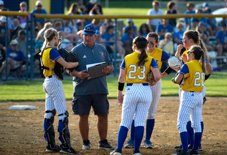 Castle Head Coach Pat Lockyear has a meeting with his infield after Bedford North Lawrence scored two more runs during the 2022 IHSAA 4A Softball Regional at Lockyear Field Tuesday evening, May 31, 2022.