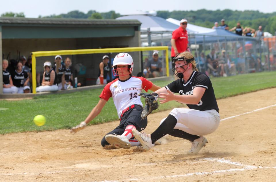 North Posey's No. 12 Alyssa Heath beats the throw to the plate as Cascade pitcher Gracelynn Gray attempts to come up with the throw after the ball got away from the catcher. This run was one of two Viking runs in Saturday's semi-state action in game one. The Vikings prevailed 2-1 in an epic pitchers' duel. 