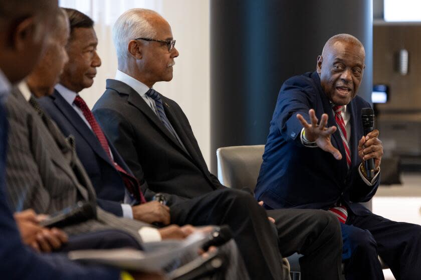 Inglewood, CA - November 08: US Navy, VADM, Ret., David L. Brewer, right, speaks as part of a panel of Black, retired, high-ranking military veterans participated in a panel, discussing their service, career challenges and work relating to the renaming commission, which seeks to assess the plausibility of renaming confederate monuments, before exploring the Kinsey African American Art & History Collection exhibit, at SoFi Stadium in Inglewood, CA, Wednesday, Nov. 8, 2023. (Jay L. Clendenin / Los Angeles Times)