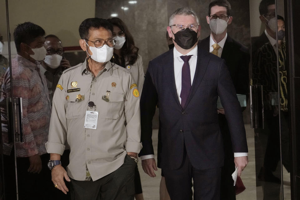 Australian Agriculture Minister Murray Watt, right, walks with his Indonesian counterpart Syahrul Yasin Limpo after their meeting in Jakarta, Indonesia, Thursday, July 14, 2022. (AP Photo/Tatan Syuflana)
