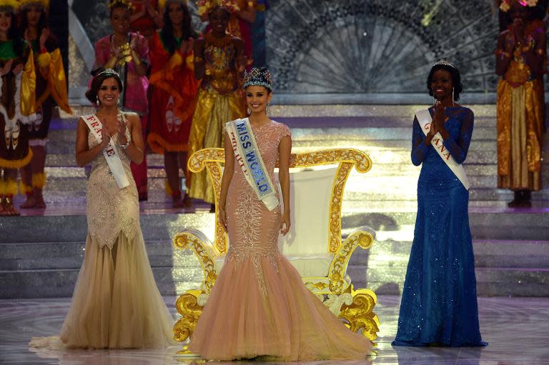 Megan Young (centre) from the Philippines poses after winning the Miss World title in Nusa Dua, on the Indonesian island of Bali on September 28, 2013