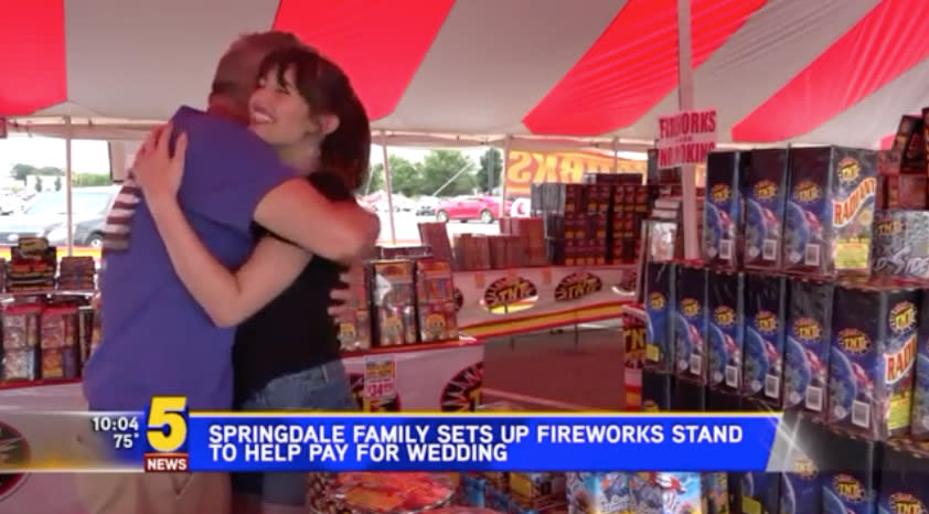 Bride-to-be Sarah Ashley hugs her dad, Heath Bryant, at the family's fireworks stand. (Photo: Courtesy of 5newsonline.com)