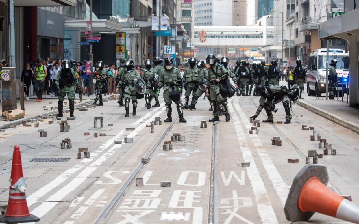 Hong Kong police removed bricks in the Central district of the city on Thursday - Bloomberg
