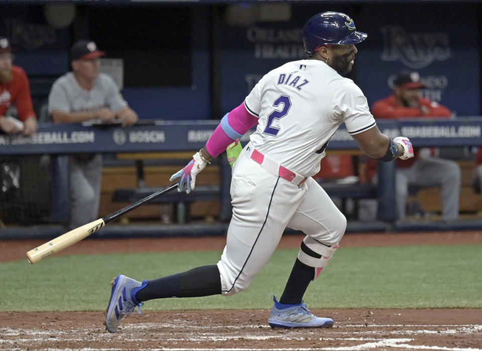 Tampa Bay Rays' Yandy Díaz watches a single to center field off Washington Nationals starter Mitchell Parker during the third inning of a baseball game Friday, June 28, 2024, in St. Petersburg, Fla. (AP Photo/Steve Nesius)