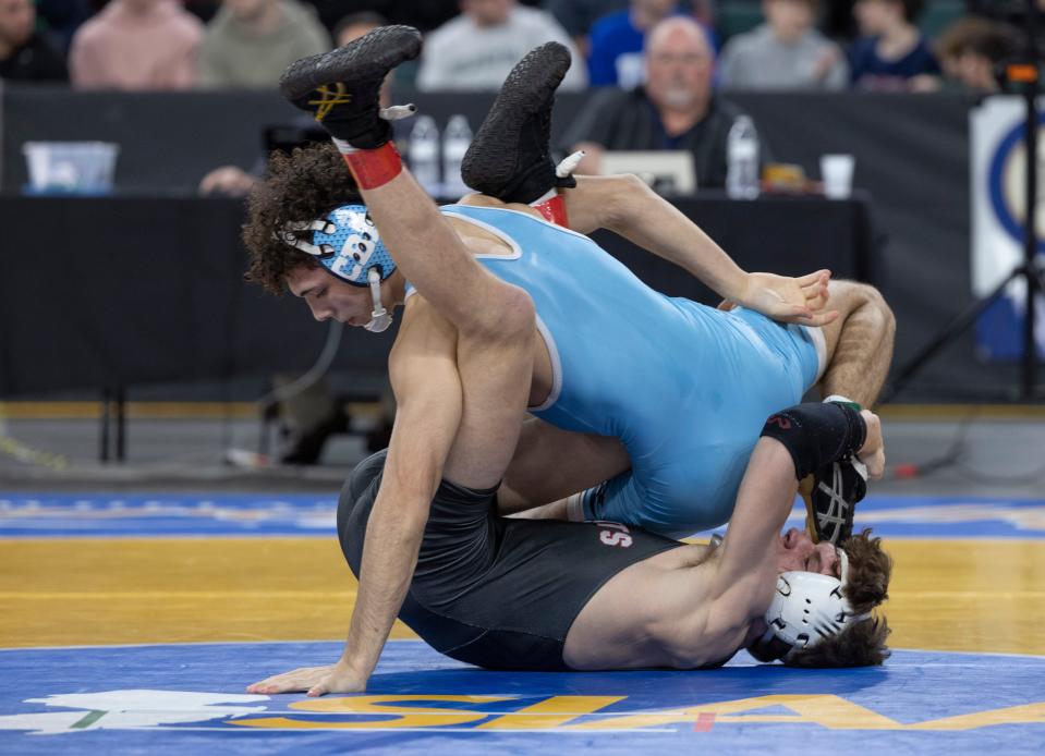 CBA's Julian George (light blue singlet) advanced to the NJSIAA 138-pound final with a 5-2 win over West Essex's Mike Pescatore.