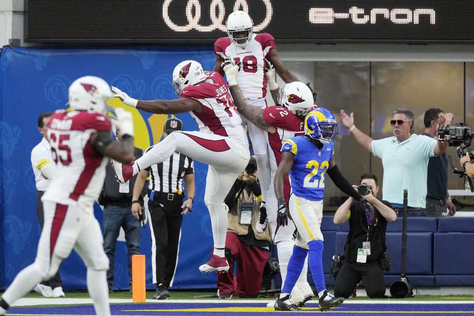 Arizona Cardinals wide receiver A.J. Green, top center, celebrates his touchdown catch with teammates during the first half of an NFL football game against the Los Angeles Rams Sunday, Nov. 13, 2022, in Inglewood, Calif. (AP Photo/Mark J. Terrill)