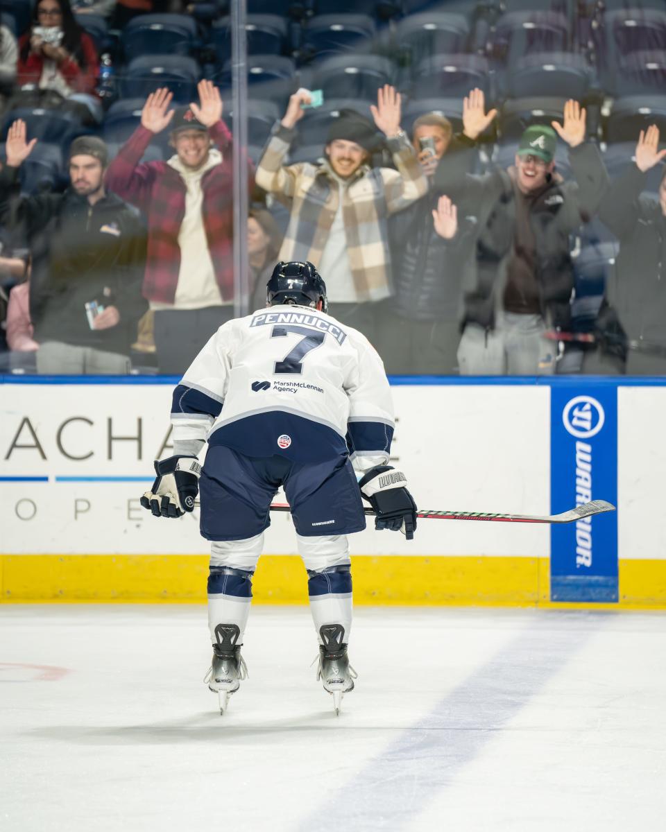 Nick Pennucci is cheered on by friends during the Worcester native's pro hockey debut.