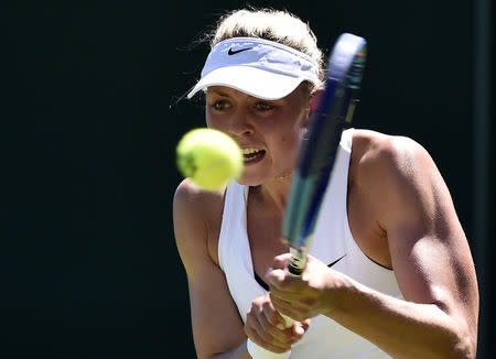 Carina Witthoeft of Germany plays a shot during her match against Angelique Kerber of Germany at the Wimbledon Tennis Championships in London, June 30, 2015. REUTERS/Toby Melville