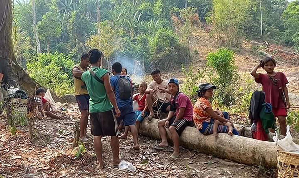 In this photo released by the Free Burma Rangers, Karen villagers gather in the forests as they hide from military airstrikes in the Deh Bu Noh area of the Papun district, north Karen state, Myanmar, Sunday, March 28, 2021. Thai authorities along its northwestern border braced themselves, Monday, for a possible influx of more ethnic Karen villagers fleeing the fear of renewed air strikes from the Myanmar military. (Free Burma Rangers via AP)