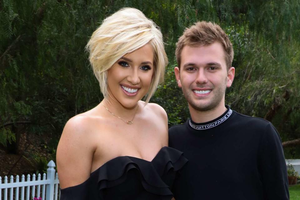<p>Paul Archuleta/Getty</p> (L-R) Savannah Chrisley and Chase Chrisley are pictured visiting Hallmark