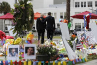 <p>President Obama and Vice President Biden depart a makeshift memorial after placing flowers in memory of shooting victims in Orlando, Fla., June 16, 2016. (Carlos Barria/Reuters) </p>