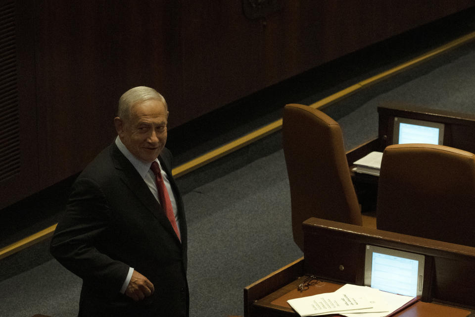 Former Israeli Prime Minister Benjamin Netanyahu attends the opening of the summer session of the Knesset, Israel's parliament, in Jerusalem, Monday, May 9, 2022. Less than a year after taking office, Naftali Bennett has lost his parliamentary majority, his own party is crumbling and a key governing partner has suspended cooperation with the coalition. That has set the stage for a possible attempt by the opposition, led by Netanyahu, to topple the government later this week. (AP Photo/Maya Alleruzzo)