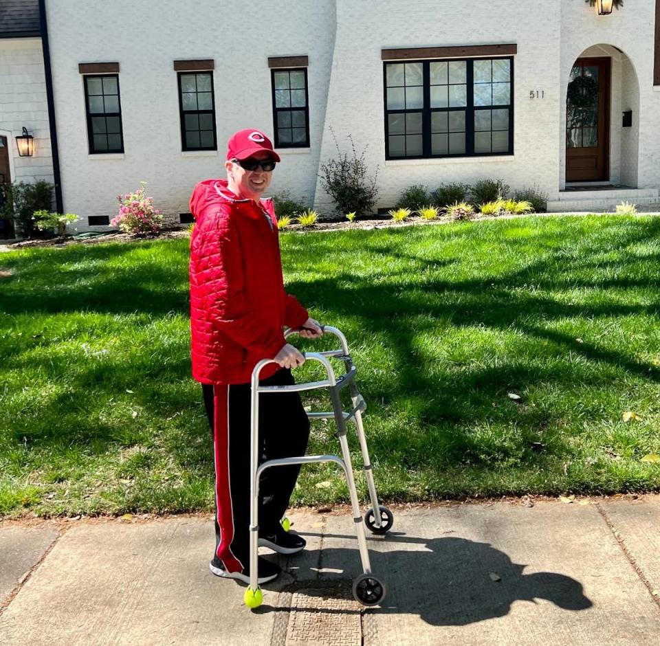 Local TV sports journalist Jason Brown uses a walker while rehabbing following his heart transplant surgery.