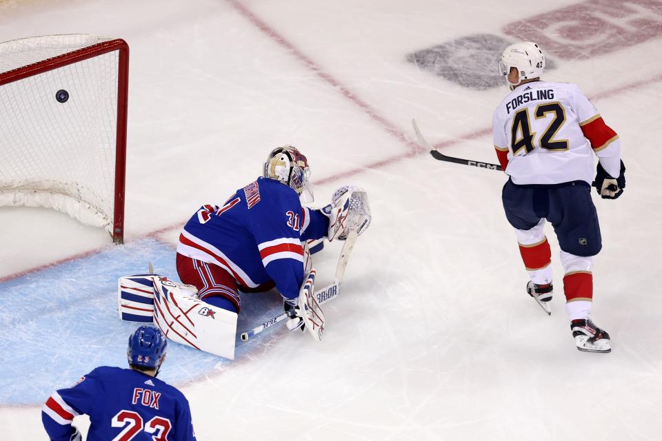 May 30, 2024; New York, New York, USA; Florida Panthers defenseman Gustav Forsling (42) scores a goal against New York Rangers goaltender Igor Shesterkin (31) during the second period of game five of the Eastern Conference Final of the 2024 Stanley Cup Playoffs at Madison Square Garden. Mandatory Credit: Brad Penner-USA TODAY Sports