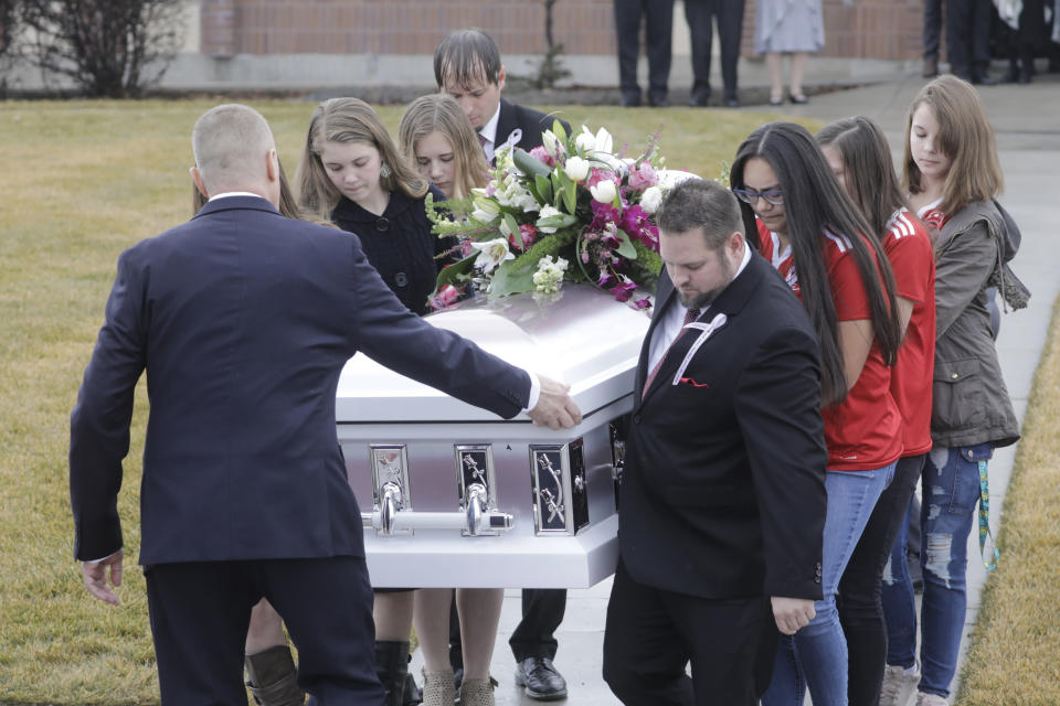 Pallbearers carry a casket following the funeral services for Consuelo Alejandra Haynie, daughters 12-year-old Milan and 15-year-old Alexis and 14-year-old son Matthew Friday, Jan. 24, 2020, in Grantsville, Utah. The killing of a Utah mother and three of her children by a gunman identified by police as her 16-year-old son is "nearly unbearable" for the father who survived, a lawyer said Thursday, Jan. 23, 2020.(AP Photo/Rick Bowmer)