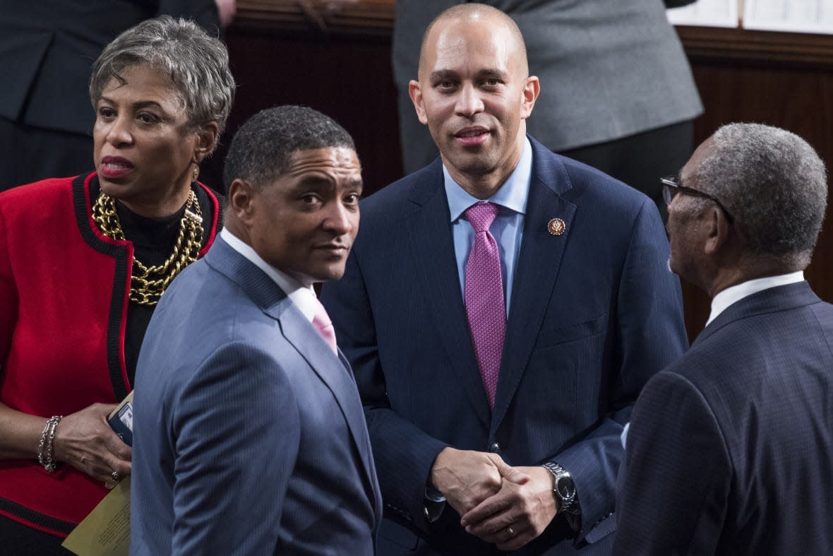 From left, Reps. Brenda Lawrence, D-Mich., Cedric Richmond, D-La., Hakeem Jeffries, D-N.Y., and Gregory Meeks, D-N.Y., are seen in the Capitol’s House chamber before members were sworn in on the first day of the 116th Congress on January 3, 2019. (Photo By Tom Williams/CQ Roll Call)