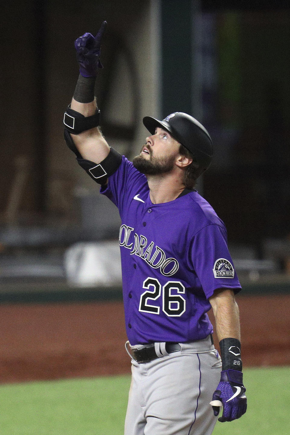 Colorado Rockies' David Dahl (26) gestures after scoring on his two-run home run in the fifth inning against the Texas Rangers in an exhibition baseball game, Tuesday, July 21, 2020 in Arlington, Texas. (AP Photo/Richard W. Rodriguez)