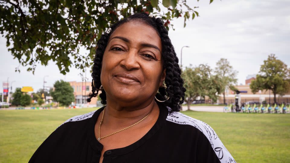 Gloria Howard, a survivor of gun violence, poses for a portrait a few yards away from where she was struck by bullets in north Minneapolis. She was serving snow cones as a volunteer for 21 Days of Peace when it happened. - Andrea Ellen Reed for CNN