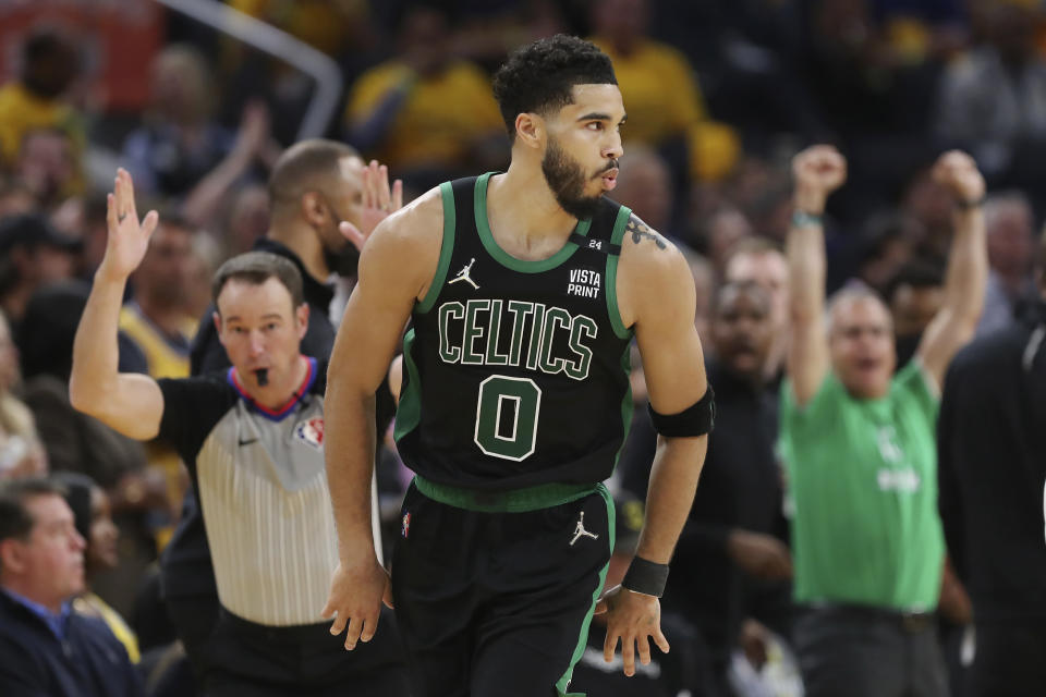 Boston Celtics forward Jayson Tatum (0) reacts after scoring against the Golden State Warriors during the second half of Game 5 of basketball's NBA Finals in San Francisco, Monday, June 13, 2022. (AP Photo/Jed Jacobsohn)