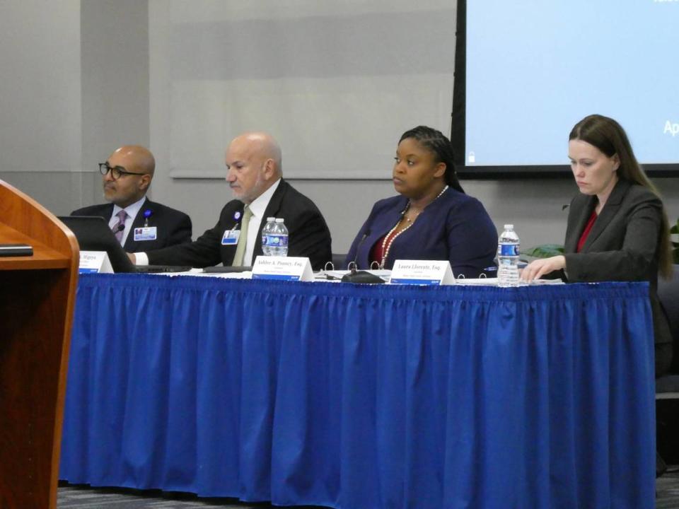 Jackson Health CEO Carlos Migoya, in the second seat from left, gives an update to the Public Health Trust on Wednesday, April 26, 2023.