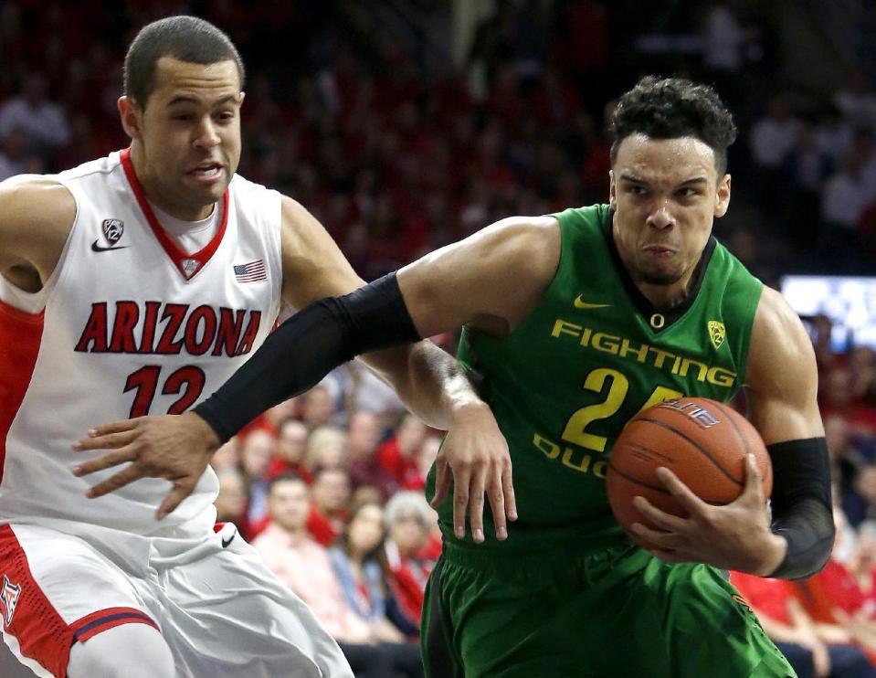 FILE -In this Jan. 28, 2016, file photo, Oregon forward Dillon Brooks (24) drives past Arizona forward Ryan Anderson during the first half of an NCAA college basketball game in Tucson, Ariz. Brooks was selected to the AP All-Pac-12 Conference first team, Tuesday, March 7, 2017. (AP Photo/Rick Scuteri, File)
