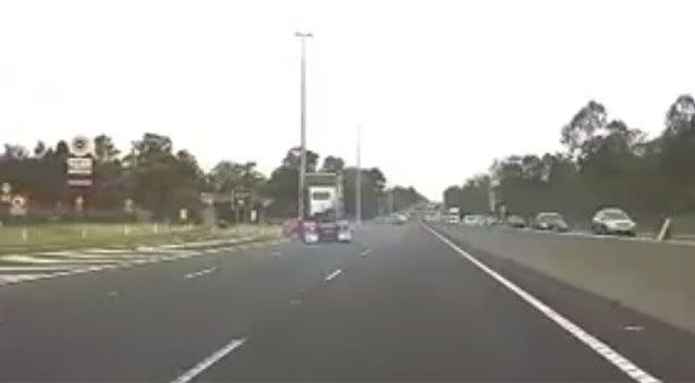 The truck and sedan make a safe stop on the edge of the highway. Pictures: Dash Cam Owners Australia/Facebook
