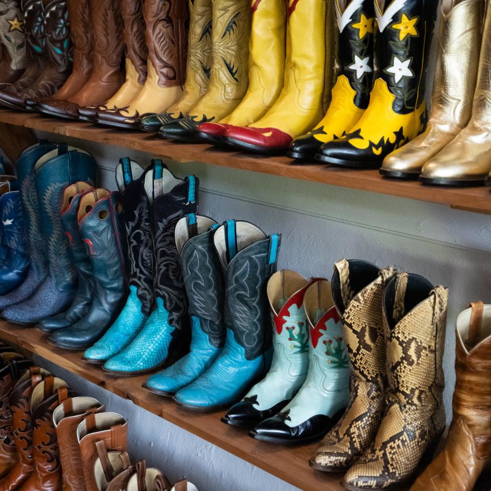 Colorful boots on display in Joey Medina's Full Circle Vintage Lockhart store, June 30, 2023. Medina collects all colors and types of boots, including some with "ride 'em cowboy" decorations and a few made of leather from sea bass, ostrich and snake.