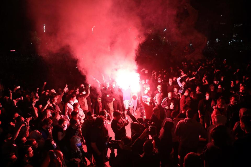 Serbian protesters flare.JPG