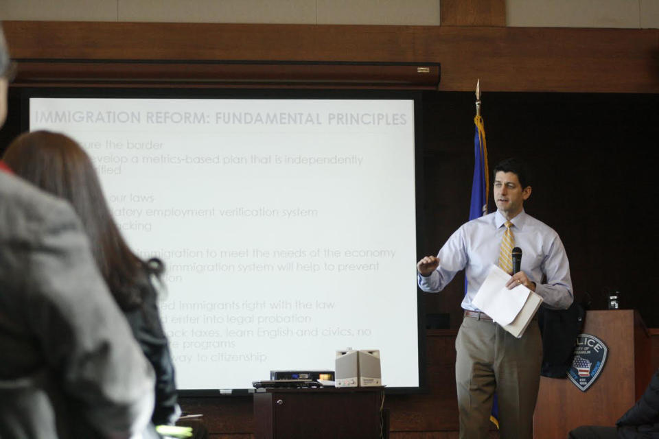 U.S. Rep. Paul Ryan, R-Wis., answers a question at a town hall meeting Tuesday, March 18, 2014, in Franklin, Wis. Ryan is kicking off four days of town hall meetings, discussing the national debt, health care and other issues. (AP Photo/M.L. Johnson)