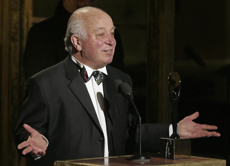 FILE - Seymour Stein accepts his award during the Rock and Roll Hall of Fame induction ceremony, Monday, March 14, 2005, in New York. Stein, the brash, prescient and highly successful founder of Sire Records who helped launched the careers of Madonna, Talking Heads and many others, died Sunday, April 2, 2023, at age 80. (AP Photo/Julie Jacobson, File)