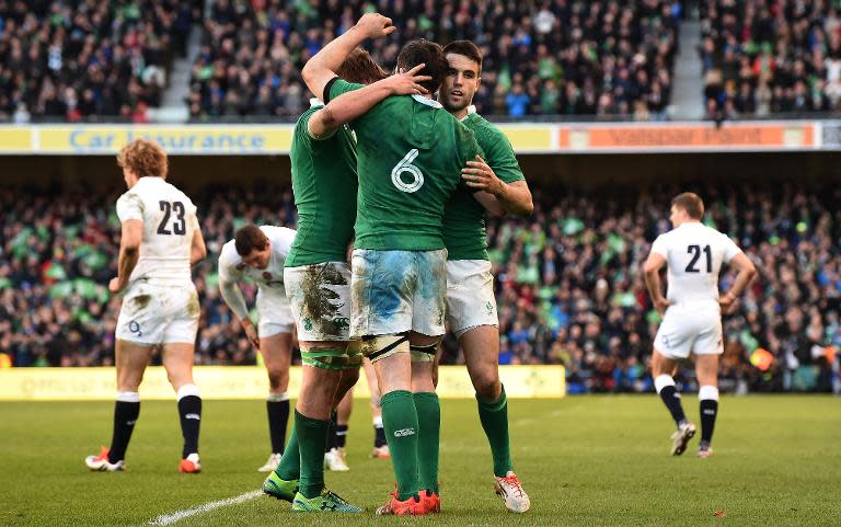 Ireland players celebrate victory at the final whistle in the Six Nations match against England at Aviva Stadium in Dublin, Ireland on March 1, 2015