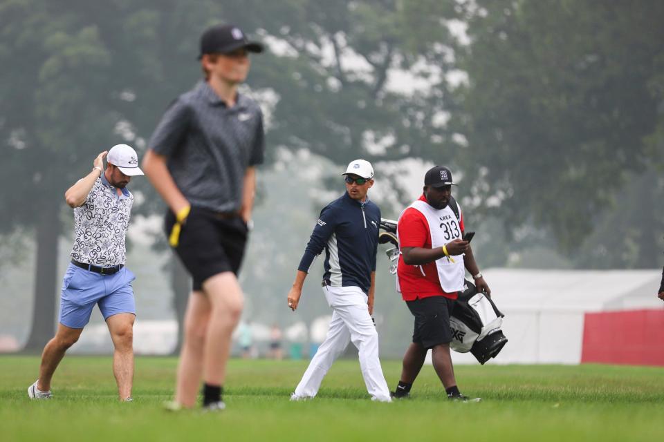 Dylan Larkin and Rickie Fowler mingle while walking along hole 14 at the AREA 313 Celebrity Scramble at Detroit Golf Club in Detroit on Tuesday, June 27, 2023.