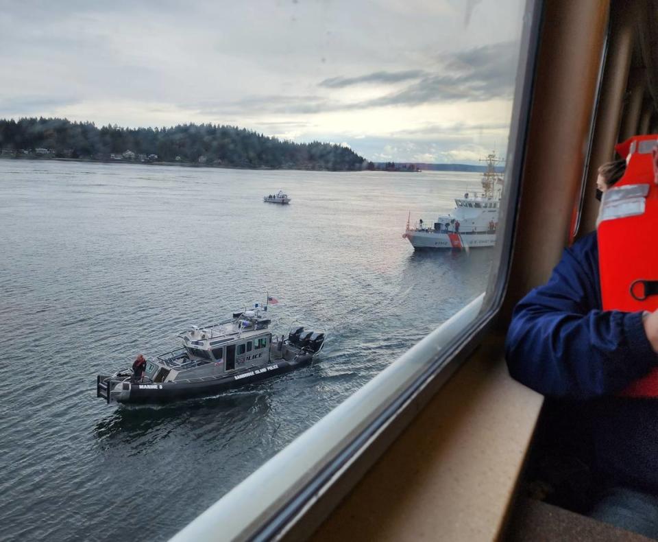 Support boats and the U.S. Coast Guard pull alongside the grounded Washington State Ferry Walla Walla on April 15 near Bainbridge Island.