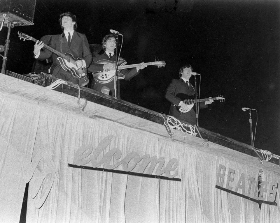 The Beatles play at the old Gator Bowl on Sept. 11, 1964, as gusts from departing Hurricane Dora whipped through the stadium.