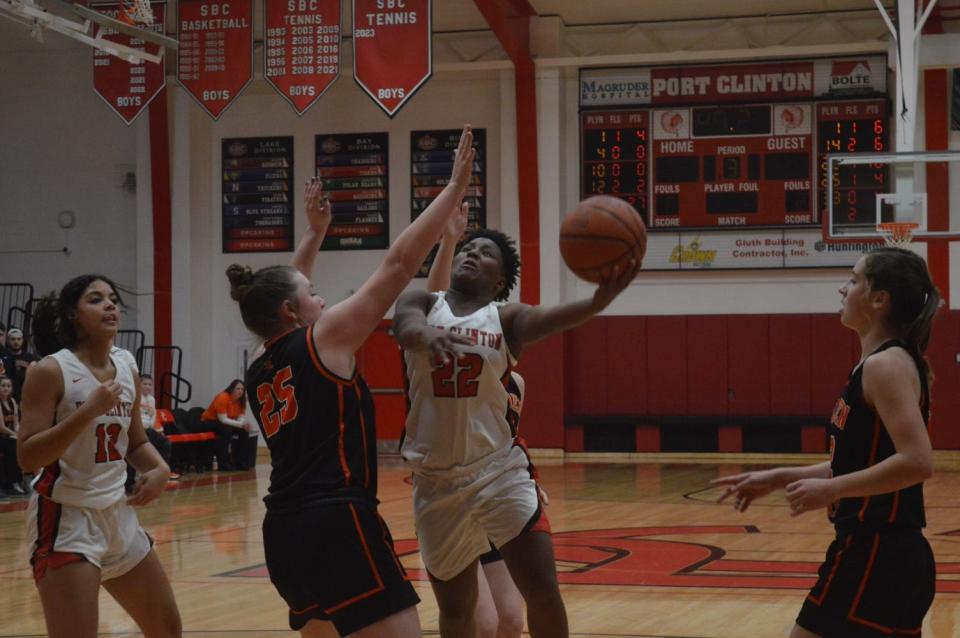 Port Clinton's DC Lanier wards off a defender.