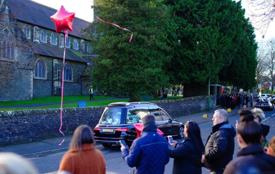 People released red balloons as the hearse carrying the coffin of Jack Lis arrived at St Martin’s Church, Caerphilly (Ben Birchall/PA) (PA Wire)