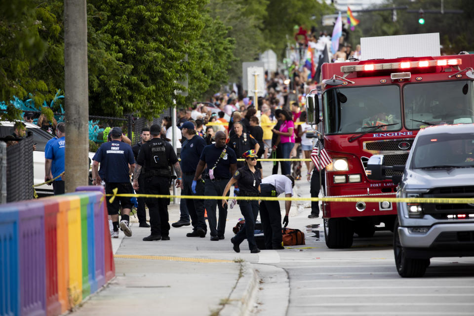 Police and firefighters respond after a truck drove into a crowd of people during The Stonewall Pride Parade and Street Festival in Wilton Manors, Fla., on Saturday, June 19, 2021. WPLG-TV reports that the driver of the truck was taken into custody. (Chris Day/South Florida Sun-Sentinel via AP)