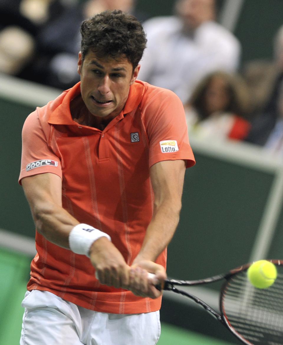 Robin Haase from the Netherlands returns the ball to Radek Stepanek from the Czech Republic during their opening single of the tennis Davis Cup first round match in Ostrava, Friday, Jan. 31, 2014. (AP Photo,CTK/Jaroslav Ozana) SLOVAKIA OUT