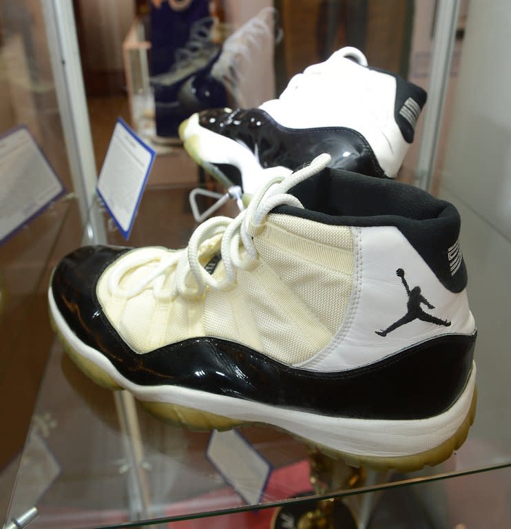 A pair of Air Jordan XI Concord basketball shoes, signed and game worn by basketball superstar Michael Jordan during the 1995-1996 season is on display in Beverly Hills, California