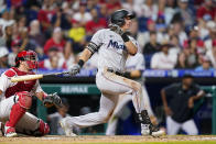 Miami Marlins' JJ Bleday follows through after hitting a run-scoring double against Philadelphia Phillies pitcher Andrew Bellatti during the eighth inning of a baseball game, Wednesday, Aug. 10, 2022, in Philadelphia. (AP Photo/Matt Slocum)