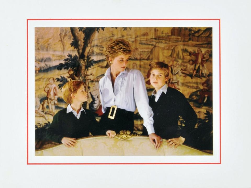 A 1993 Christmas card sent from Diana featuring a photograph of the Princess with Princes William and Harry (Shutterstock)