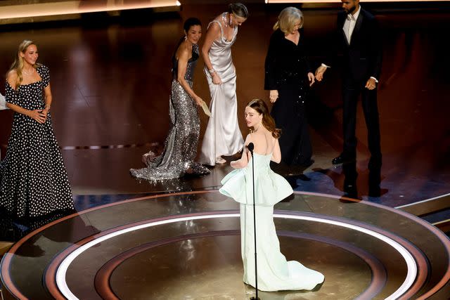 <p>Rich Polk/Variety via Getty</p> Emma Stone jokes about her broken Louis Vuitton dress at the 2024 Oscars