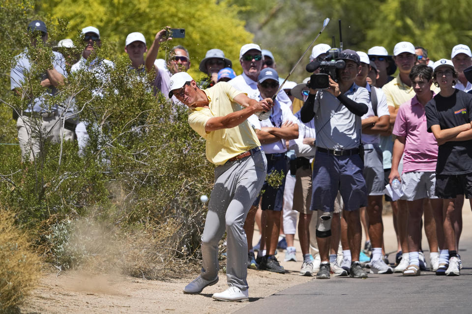 Georgia Tech golfer Christo Lamprecht hits from along the cart path on the first fairway during the final round of the NCAA college men's match play golf championship, Wednesday, May 31, 2023, in Scottsdale, Ariz. (AP Photo/Matt York)