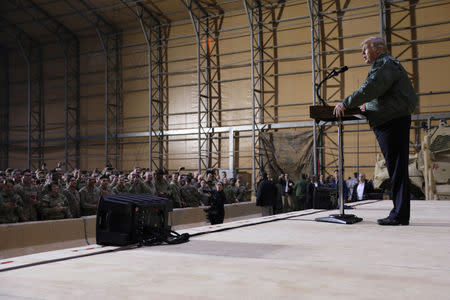 U.S. President Donald Trump delivers remarks to U.S. troops in an unannounced visit to Al Asad Air Base, Iraq December 26, 2018. REUTERS/Jonathan Ernst