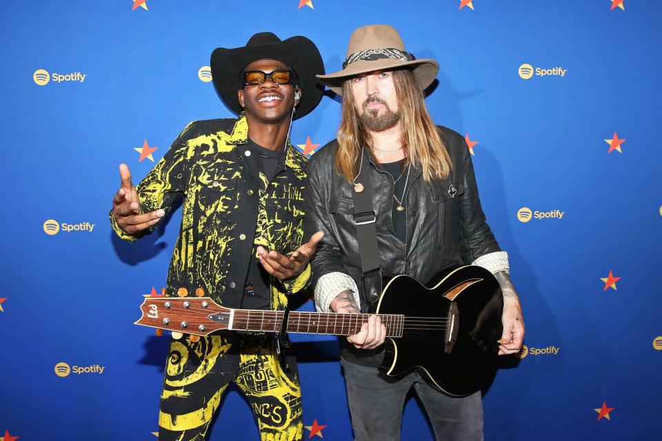 Lil Nas X and Billy Ray Cyrus visit the Spotify House during CMA Fest at Ole Red on Thursday in Nashville.